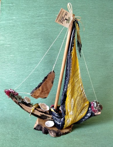 Sailing ship with black and yellow gauze sail